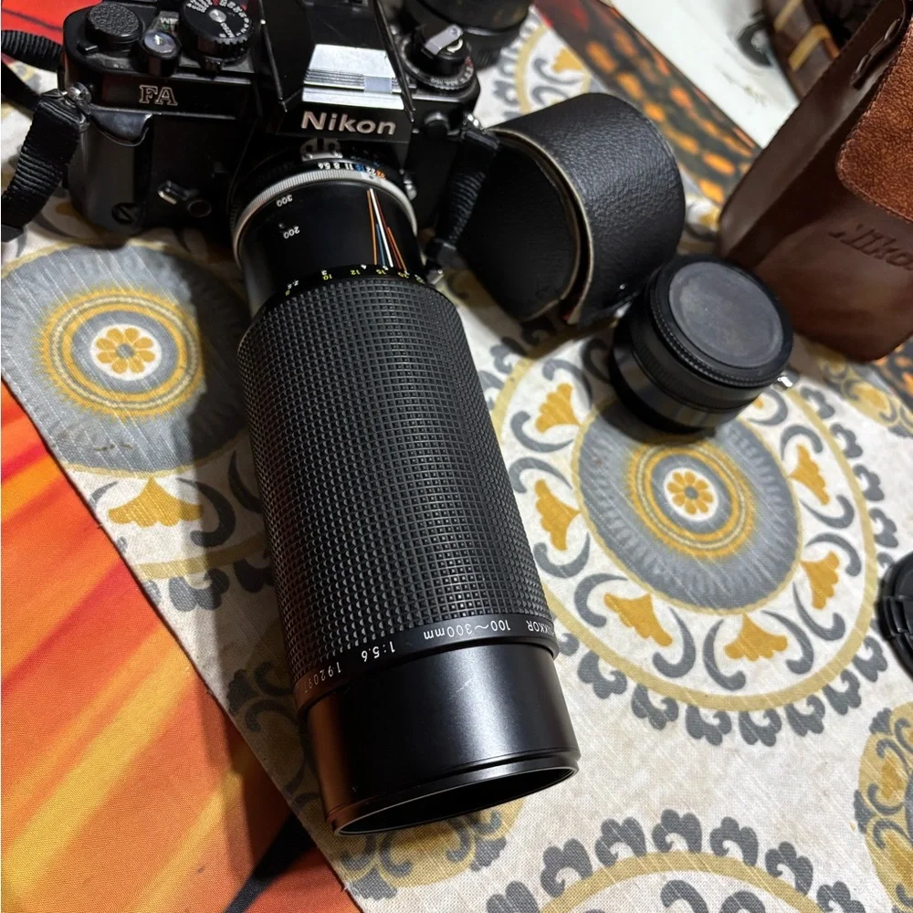 Nikon Black 300mm Telephoto Lens camera and multiple lenses and other parts